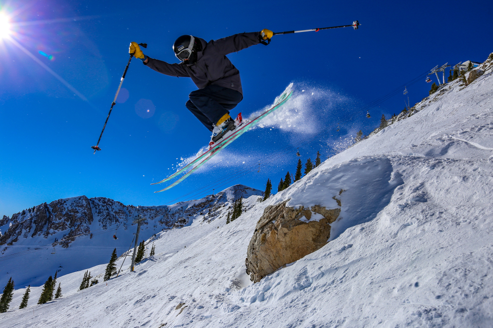 Teenager ski jumping in Alta, Utah